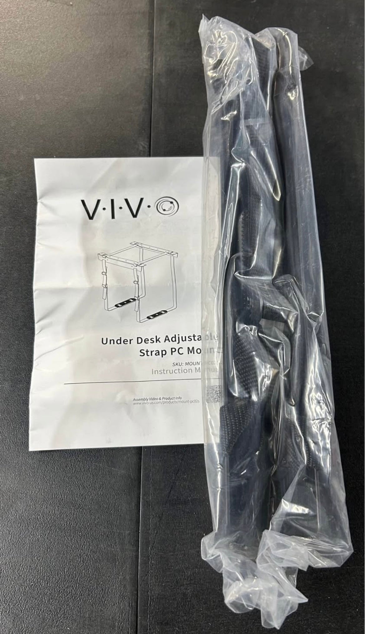 Under desk adjustable strap pc mount